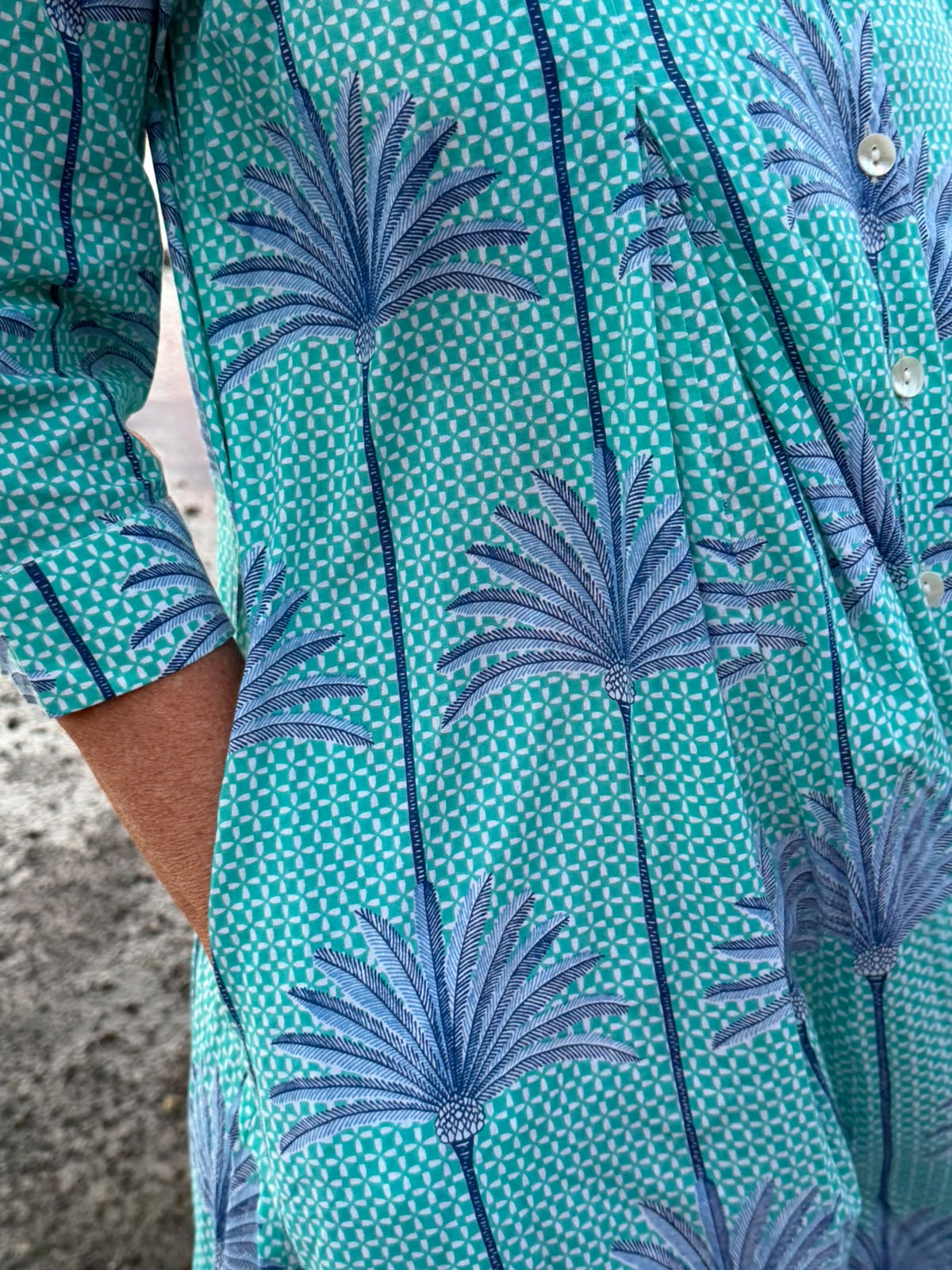 Jilly Jumpsuit Turquoise and White background with Blue Palms