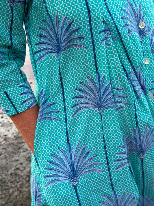 Jilly Jumpsuit Turquoise and White background with Blue Palms