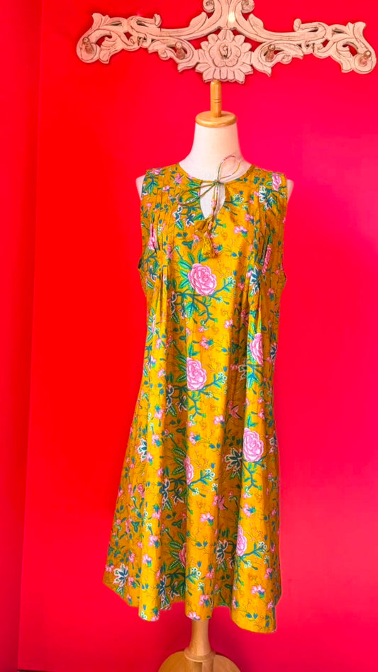 Ladies Nighties _ Mustard-Golden Yellow Base with Dense Floral in Soft Pink Roses and Rose-Like Blooms, Mixed with Smaller Pink Buds and Flowers. The Foliage is in Shades Of Green