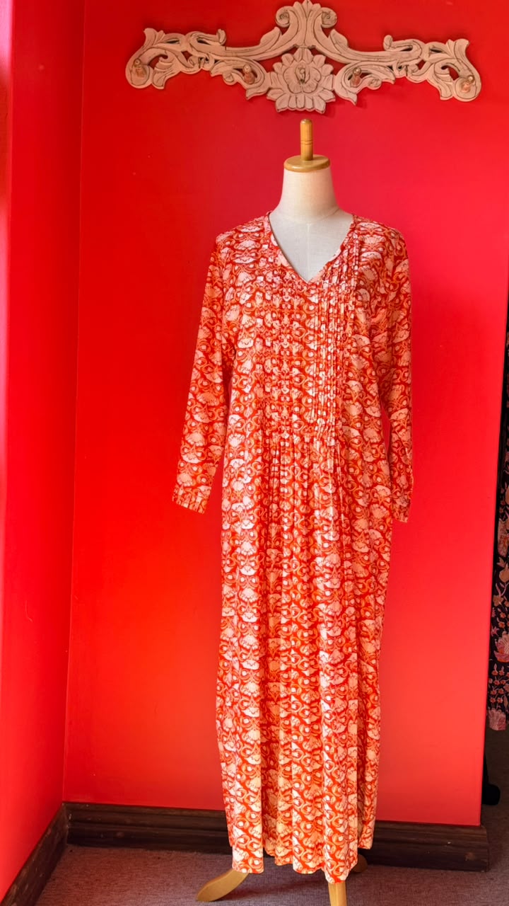 Sarah Lee Pleated Dress - Orange Background with Ornate white Flowers and Vines