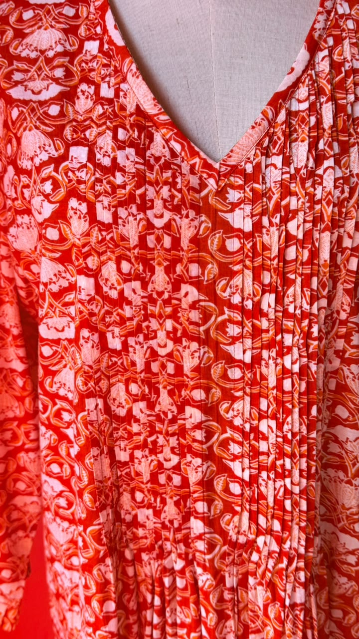 Sarah Lee Pleated Dress - Orange Background with Ornate white Flowers and Vines