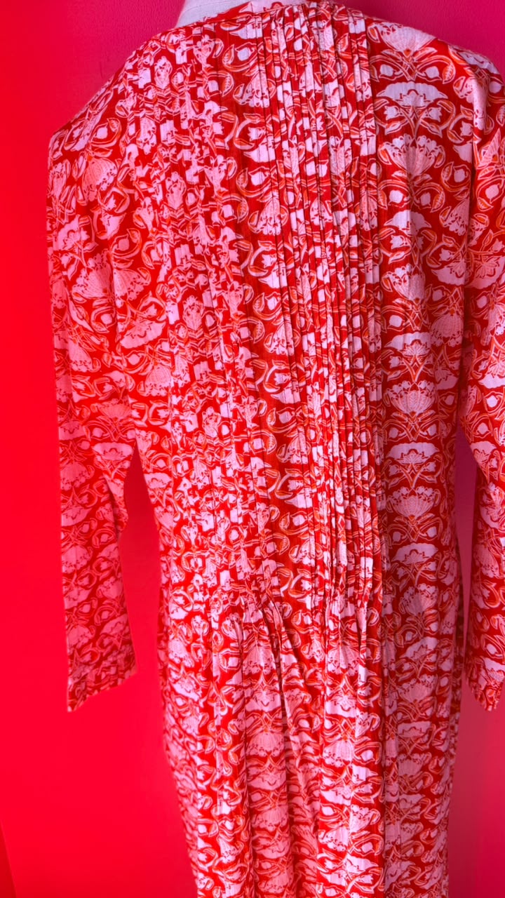 Sarah Lee Pleated Dress - Orange Background with Ornate white Flowers and Vines